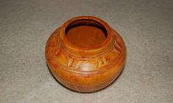 For those who look for the neat little trinkets. Beautiful burnt orange vase. Hand-made, with a inscription on the bottom. The vase has a height of 4 3/4 inches and a diameter of 6 inches. Comes with a vanilla scented candle. It's about 30 years old. A