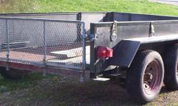 THIS 10 X 6 FT TANDEM AXEL TRAILER CAN HOLD UP TO 5000 LBS.IT IS A WELL BUILT HEAVY DUTY TRAILER FOR ALL THOSE BIG JOBS YOU HAVE TO DO.  THE FLOOR IS STEEL GRILLS, AND RAMPS ARE INCLUDED SO YOU CAN DRIVE YOUR ATV or SNOWMOBILE ONTO IT. LOTS OF TIE DOWNS