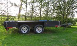 I have a excellent landscape trailer for possible trade for a snowmobile. This trailer is in excellent shape. Its not made out of tin like one you would buy from canadian tire. Its made from 1/4" checker plate steel with heavy tube steel frame. Tires are