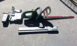 Yardworks battery powered hedge trimmer. Battery charger included.