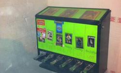 I have for sale an old style vending machine for selling hobby cards (hockey, baseball, pokeman etc)
It is a very heavy unit measuring 26.5" x 22" x 8" deep, plus the stand which is 26" high.
It has 6 vending slots ranging from 25 cent to $1  (cannot