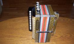 For sale, a hohner one row diatonic button accordion with four stops, HA-114, made in Germany, in the key of C. This is a beautiful sounding accordion, all stops function well. Overall, it is in good condition.