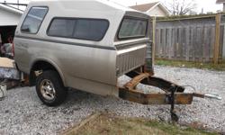 cap covered 1/2 ton back end with 2" hitch, trailer jack and working lights. lockable tailgate and cap. already had licensed.$750.00.