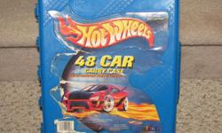 Hello, we are selling a Hot Wheels case for toy cars and 24 toy cars. The toy cars are not Hot Wheels brands, they are random brands.
The case has some wear to the front sticker. It holds 48 cars. The cars are in good to very good condition; some have a