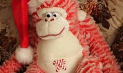 Christmas candy cane monkey, long arms, cuddly, ready for Christmas, picture shows how large the monkey is as my son is sitting beside it and he is 2. Check out my other adds.