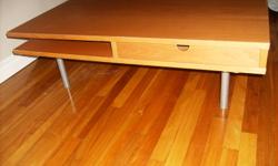 IKEA MODERN COFFEE TABLE... HAS SOME WEAR... 37 1/2 BY 37 1/2 2 PULL OUT DRAWERS AT THE CORNERS AND 2 CORNER SHELFS MAKE AN OFFER MATHESON LOCATION