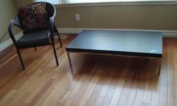 IKEA coffee table in black/brown wood grain on chrome frame and like new condition.
11"H, 23" D, 46 1/2" W