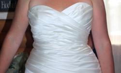Simple ivory wedding dress that flatters any figure. Purchased at Moments in Truro, in August 2011. Sizes 12 to 16, can be altered easily. Drycleaned and ready to go. Near Truro. Please e-mail or call 662-3800  leave message. Ask for Tanya.