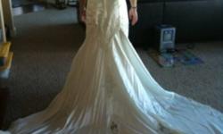 Ivory lace mermaid wedding dress. beautiful beeding and lace detail, with a 3 foot train. Size 9.
Worn once by mistake!
This ad was posted with the Kijiji Classifieds app.