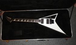 A '04 Randy Rhoads by Jackson made in U.S.A. with upgraded EMG active pick ups.
My guitar Goes for 2,500 New.
http://www.musiciansfriend.com/guitars/jackson-usa-rr1-randy-rhoads-select-series-electric-guitar
If you click on "please select a style" on the