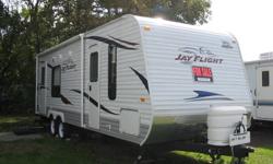 24 foot trailer - nearly new - used less than two weeks, less than 500 kilometres, with front and rear entrance, slide out, sleeps 5, queen bed with privacy screen, 3 burner gas stove with oven, large fridge/freezer, furnace, A/C, 3 piece bathroom,