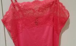 Red spaghetti strap casual slip. Lace detail.
Can be worn under blouses, or on it's own. Never worn.