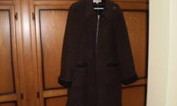 Description: This listing is for a Jones of New York Sport Women's coat. It is a wool blend and is in very good condition.  The coat is a size ten, but seems quite big for a ten according to my measurements. It's approximately equal to a size 12. The coat