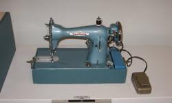 For Sale:  Kenmore electric Sewing Machine. Old portable model, but in good working condition. Comes with a supply of bobins and needles.