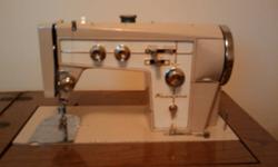 I have a Kenmore Tri Span 88 Automatic in very good condition in the original cabinet that comes with 30 embroidery cams, extra feet in the accessory kit. The machine is very clean and the motor has new brushes and also has a new drive belt and bobbin