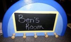 I recreate things out of old objects and I made this childrens chalkboard decor. It can be used in a bedroom or on a door etc.
There is also a before picture.
The black center piece is chalkboard so you can write on it and there are 5 attached mini