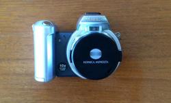 2004 Konica Minolta Model: Dimage Z2.
Camera is 4MP with 10x optical zoom with 1 1/4" digital viewing window as well as eye piece viewer.
Comes with shoulder strap, 16mp memory card, lens cap, and has additional overhead flip-up flash for tri pod or
