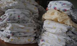 15 AIO Kushies cloth diapers for 22-45 lbs.
used and lightly stained, but still have lots of life left in them!
also includes 8 cotton liners...
