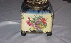 FOR SALE - BEAUTIFUL FLORAL FLOWER VASE WITH ORIGINAL METAL SCREEN TOP. STAMP ON THE BOTTOM READS MADE IN ENGLAND L. & SONS LTD MEASURES 5 1/2" TALL  x  5" WIDE ON ALL FOUR SIDES.  IT IS SQUARE SHAPE AND HAS COLORFUL FLOWER BLOOMS ON ALL FOUR SIDES.  IN