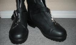 Pair of ladies brand new black winter boots, size 8. "NORTHERN CLIMATE" All man made material with black "fur" lining.Heavy, durable quality with grooves in sole. Brand new, never been worn.Zipper and strap with velcro to close.