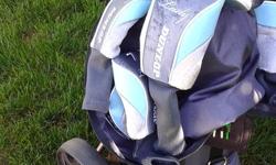 Ladies Right Handed Golf Clubs - Dunlop, selling along with titanium cart, size 7 Foot Joy golf shoes, 5 wood Jazz Signature Series, club covers. Only used a couple of times last year, golfing is not for me.