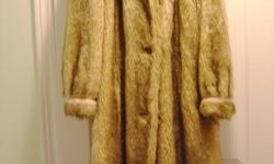 You?ll be warm & cozy this winter in this full-length fun fur / faux fur wolf / coyote coat (below the knees). Note the lovely shawl collar and cuff detail on the sleeves. There are 2 side inseam pockets. It features a 3-button closure with the buttons