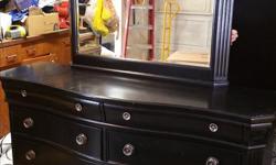 Black 8 drawer dresser with detachable mirror. Top two drawers are shallow and lined with black felt. Some scratches to the paint which have been painted over.
Size:
5'4" wide
1'8" deep
3'2.5" tall (without mirror)
Mirror adds 3'3" to height
Text Melanie: