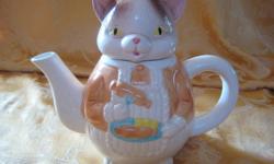 This "Kitty Cat" tea pot is so very cute and unique. It would be perfect for a little, (or big,) girl, or to add to a collection.
It measures 7.5" from bottom to top (tip of ears,) and approximately 16" in circumference, holding a full 16 cups of liquid.