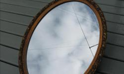 Near new condition....
HEAVY CRYSTAL MIRROR with a gold-painted ~gilded wooden frame and a metal back incorporating a hanging slot.
30" x 22" Oval
I'm selling this for a friend who has re-decorated her home [this mirror no longer matches her decor].
Her