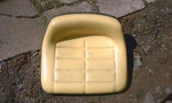 new lawn mower seat never used . yellow john deere emblem insert . only $49. delivery possible. ph. 9028593250