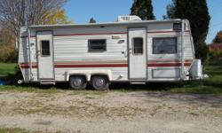 Very good condition.  Double bed in the back with room divider.  Bath has shower and small tub.   Dinette folds down to form bed.   Front upper cabinets fold down to make a bunk.   Has propane stove, sink, running water, good refrigerator that operates