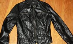 Motorcycle style women Leather jacket ( Not real Leather) Very nice fit, lots of detail and zippers.
 
Size L Asking $8 OBO