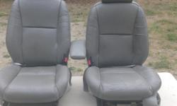 Seats are in good shape no rips driverside is power adjust .