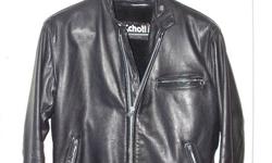This is a Schott leather jacket for sale. Deluxe Heavy Steerhide Single Rider Leather Jacket has bi-swing back, underarm footballs, adjustable stand-up collar and side tabs, and zip-out pile lining. It is a 42 Regular. This jacket is in spectacular shape