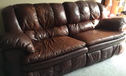 Leather full length reclining sofa made by Ashley Furniture. The full length of the sofa reclines, and is very comfortable. There is the expected wear as we've had it for about 8 years. Still in good condition though. It is easy to move as each side can