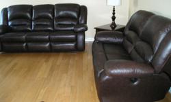 Mint condition power reclining brown leather loveseat and matching reclining sofa. Purchased Jan 2015 and comes with a full 5 year blanket coverage warranty! The model is still available at the Brick and lists for approx $3700 plus tax plus additional