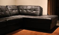 Black right facing sectional sofa paid 1279.97 in 2014 and it is in good condition non-smoking home.We have moved and it doesnt fit our space.