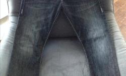 Barely worn charcoal/black wash, men's True Religion Ricky Jeans with grey Super T stitching. 32 seat which equates to a 33/34 inch waist. 31 inch inseam.
A true deal!