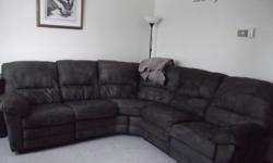 hi, i have a dark green sectional, it reclines on both ends. im not sure the material is called but it is extremly easy to clean. i have only had it for one year but i am moving feb.1st and i do not feel like moving it
 
I paid 3400 brand new for it, it