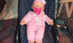 Hello....I'm Kimberly and I'm selling a little baby girl doll to you. She's quite tiny, lightweight and is in terrific shape. The doll also has a magnetic soother that instantly clamps onto her mouth. She's really cute and would be a great little toy for