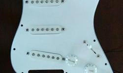 2007 Standard Fender Stratocaster pickguard (MIM) with all original pickups, switches, and pots. Factory metal foil grounding. Give your Squire or similar the heart of a real Stratocaster. Only need to connect 3 wires (labelled).