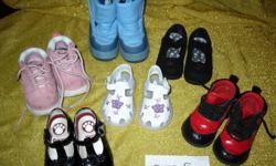 All are in very good to excellent used condition and come from a non-smoking home.
1)  Black suede Mary Jane's.  Farrah 2 Premier Collection.  Velcro strap.  Rosette on toes. No scuffs or signs of wear.  Like new.
2)  White sandals with purple