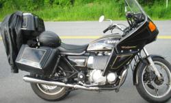 one of a kind Great working GS1000G touring Suzuki.
new battery, new windshield and still have the original windshield.
stereo mp3 and thumb drive hook up alpine stereo. full windjammer vetter fairings side bags and trunk...all hardshell. extra brand new