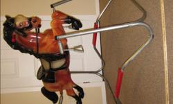 Mattel Spring Horse
- Durable and in excellent condition
- Eyes move up and down
- Has reins
- MP brand on horse's rump
- Step-up to mount into saddle
- Wooden bar and metal stirrup option
- Measurements: Horse - length = 38" and height = 24"
Frame -
