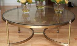 For sale is a lovely round metal coffee table with glass top. It measures 36 1/2" in diameter and  stands 17" high.  It is in good condition . Please email any enquiries.