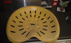 This metal Tractor Seat is painted yellow in color and has a small crack in the middle of the seat.   There are no markings or number on the seat.  if you have any questions please email me and also check out our other ads.