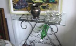 See Pictures,   We accept cash only...
1) This Piece is an all pewter coloured metal floor model Wine Rack Table ..complete with plate Glass top, zIt hold 19 winebottles... Asking $44.99
2-8) Just a small selection of pictures of a variety of items