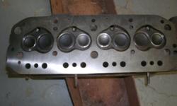 Machine shop rebuilt MGB cylinder head. New valves, trued surface. I have other MG parts including Twin SU carburetors, Intake and exhaust manifold, and a roll bar for an MGB.