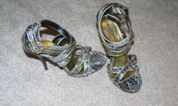 Brand new and never worn. Faux Snake Skin and gold. Size 6.5
