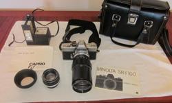 Minolta SRT101 35mm film camera.
200mm Rokkor lens, 55mm Rokkor lens, Capro solid state re-chargeable flash and case.